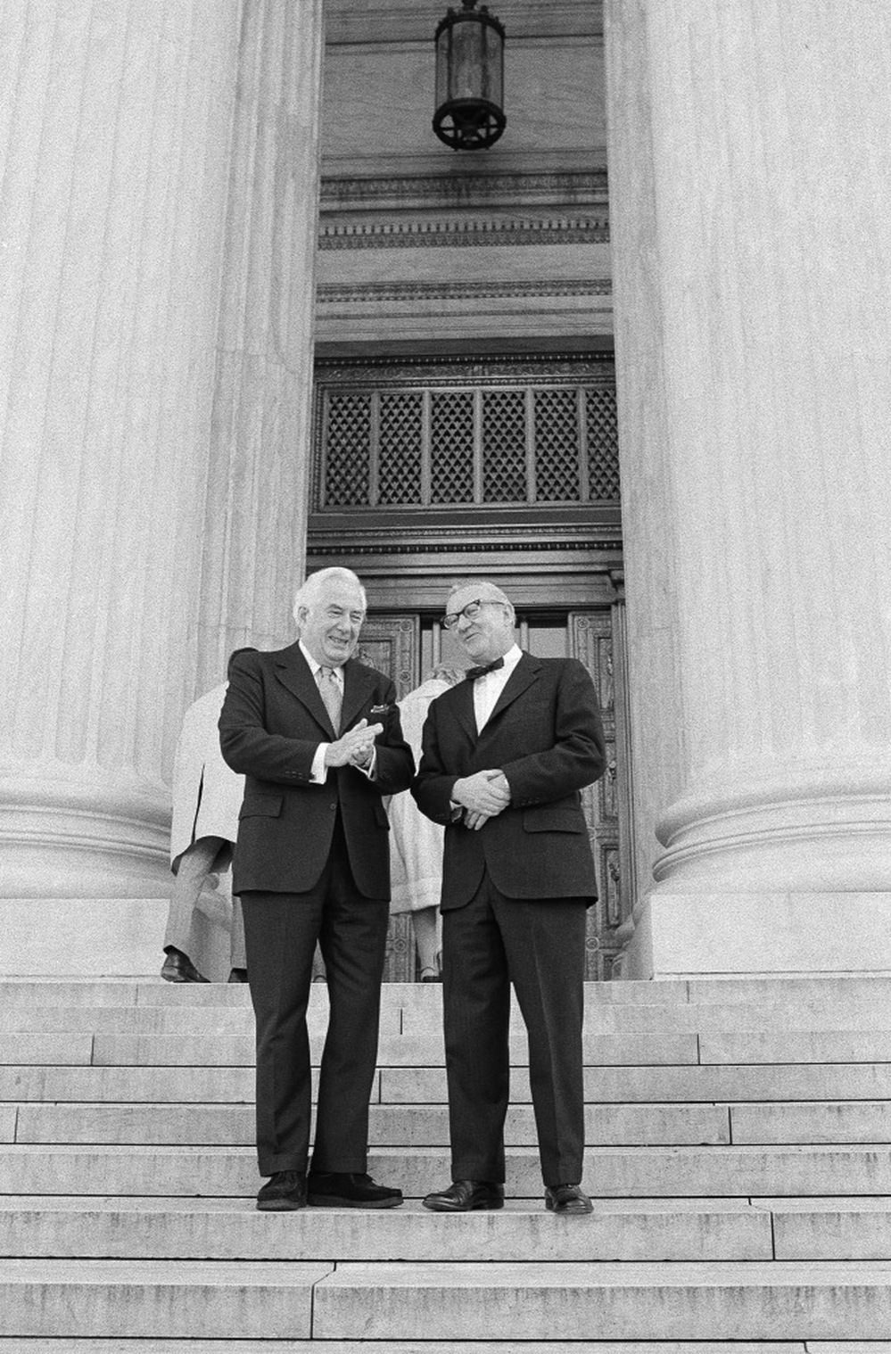 December 1975: Chief Justice Warren Burger (left) talks with Stevens on the steps of the Supreme Court before Stevens' swearing in as the 101st justice.