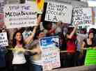 Protesters shout slogans while holding banners Monday at  Occupy Wall Street protests in Los Angeles. 
