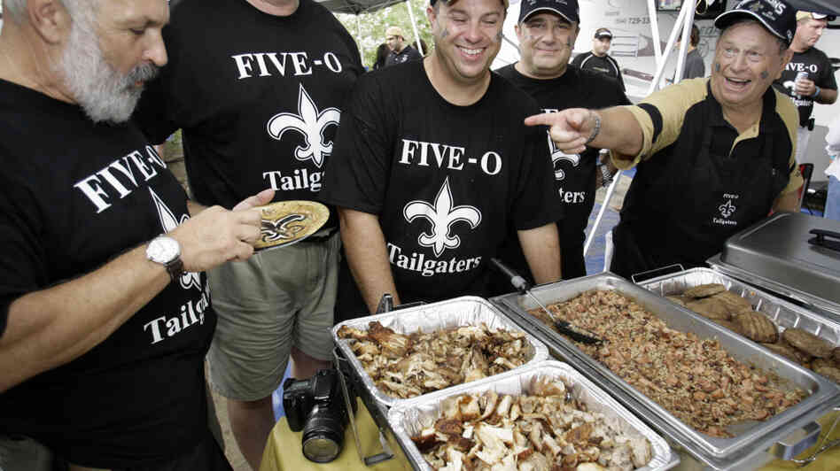 Tailgaters enjoy the food before a Tennessee Titans-New Orleans Saints football game in 2007.