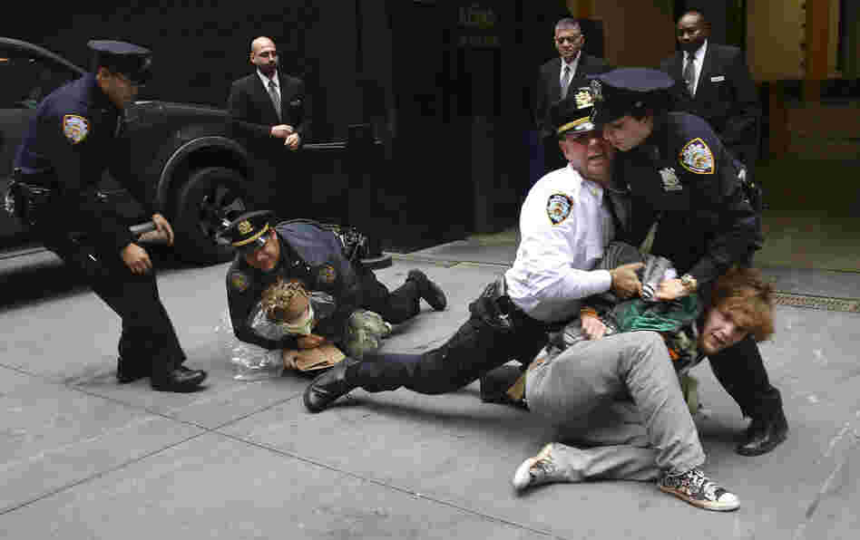 Occupy Wall Street protesters are arrested Wednesday during a march near One Chase Manhattan Plaza in New York. The protest is now in its fourth week. 