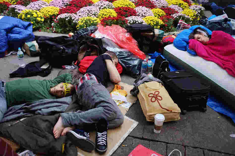 Protesters sleep in the park on Sept. 26. Nearly 80 people were arrested the weekend before in a series of incidents with the police as the protesters attempted to march uptown. 