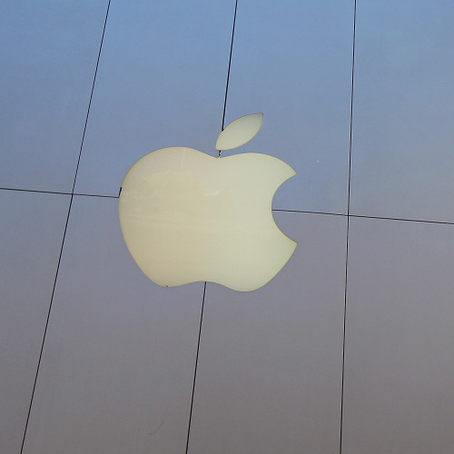 A pedestrian walks by an Apple Store in San Francisco, California. 