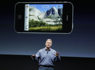 Apple marketing executive Phil Schiller describes the new iPhone 4S's camera, which includes 1080p HD video, at Apple headquarters in Cupertino, Calif. Apple marketing executive Phil Schiller describes the new iPhone 4S's camera, which includes 1080p HD video, at Apple headquarters in Cupertino, Calif.