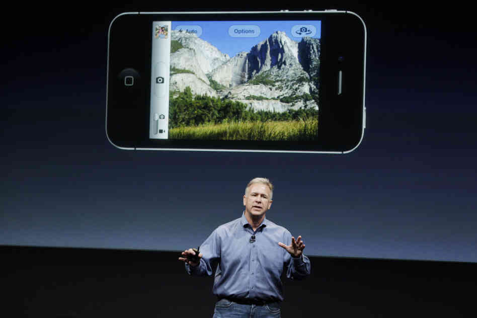 Apple marketing executive Phil Schiller describes the new iPhone 4S's camera, which includes 1080p HD video, at Apple headquarters in Cupertino, Calif. Apple marketing executive Phil Schiller describes the new iPhone 4S's camera, which includes 1080p HD video, at Apple headquarters in Cupertino, Calif.