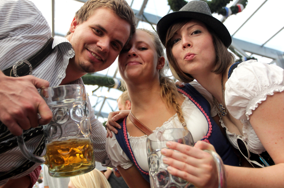 Revelers clink their beer mugs inside a beer tent on the last day of Oktoberfest in Munich. The festival drew some 6.9 million visitors this year.