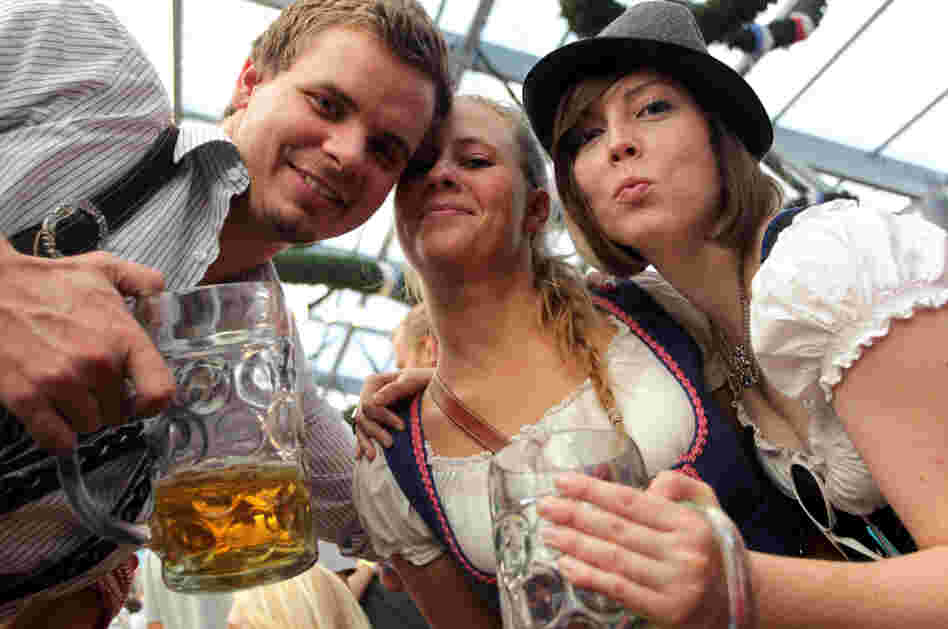 Revelers clink their beer mugs inside a beer tent on the last day of Oktoberfest in Munich. The festival drew some 6.9 million visitors this year.
