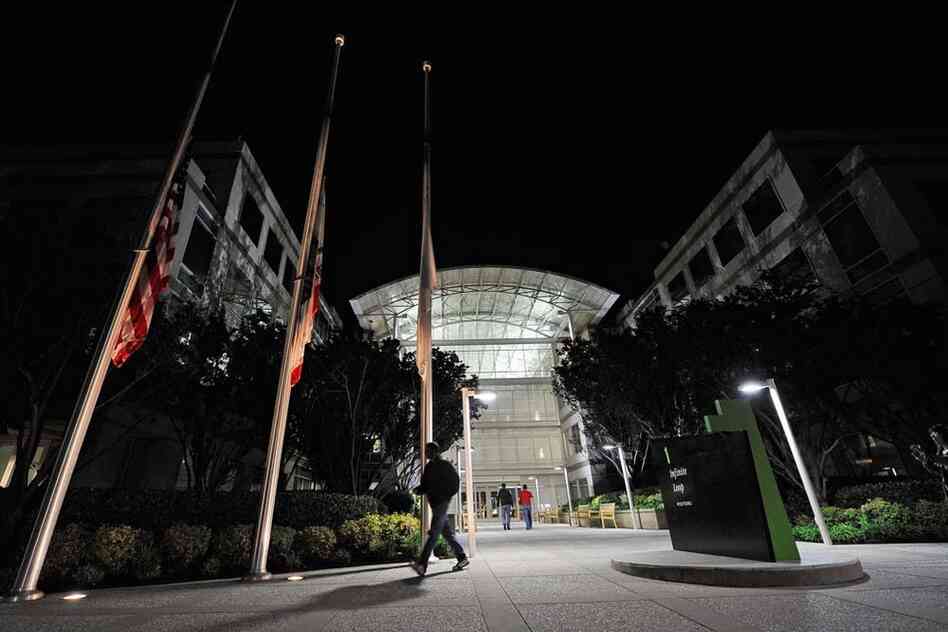 Flags fly at half staff after the death of Steve Jobs at the Apple headquarters in Cupertino, Calif. 