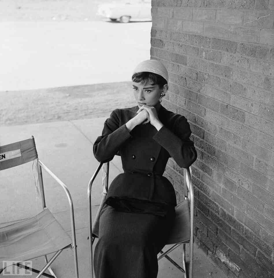 Givenchy and Hepburn met in 1953, during the making of Sabrina, and became close friends and collaborators. Pictured here is Hepburn in Givenchy on movie set. 