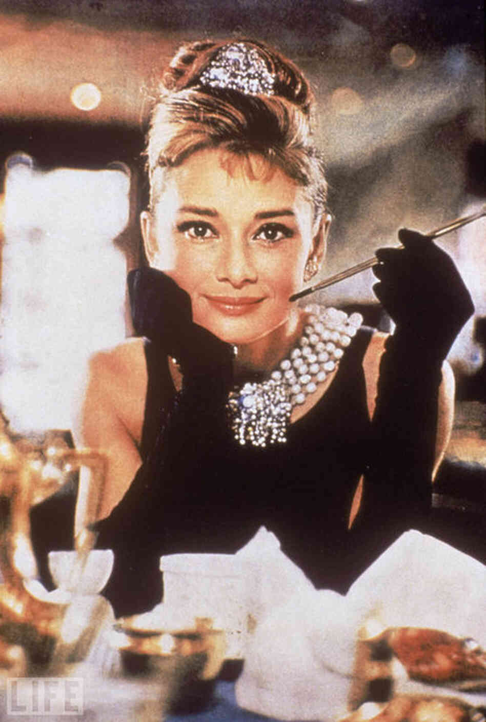 Audrey Hepburn wears the iconic Givenchy dress in "Breakfast At Tiffany's." 