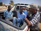 A revolutionary fighter watches over two suspected Gadhafi loyalists in Sirte, Libya, last month. By some estimates, up to 30 to 40 percent of Libyans are sympathetic to former dictator Moammar Gadhafi. A revolutionary fighter watches over two suspected Gadhafi loyalists in Sirte, Libya, last month. By some estimates, up to 30 to 40 percent of Libyans are sympathetic to former dictator Moammar Gadhafi.