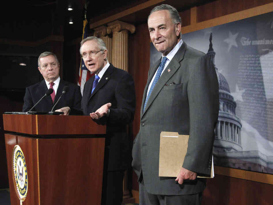 Senate Majority Leader Harry Reid unveils his surtax proposal flanked by Sens. Richard Durbin (l) and Charles Schumer, Oct. 5, 2011. 