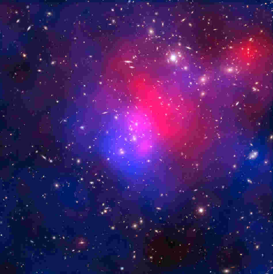 This image combines visible light exposures of galaxy cluster Abell 2744 taken by the NASA/ESA Hubble Space Telescope and the European Southern Observatory's Very Large Telescope, with X-ray data from NASA's Chandra X-ray Observatory and a mathematical reconstruction of the location of dark matter.