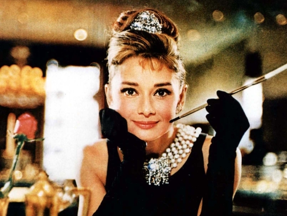 This photo released by Christie's auction house shows actress Audrey Hepburn in the 1961 film, Breakfast at Tiffany's. The black Givenchy dress worn by Hepburn sold at auction for $807,000.