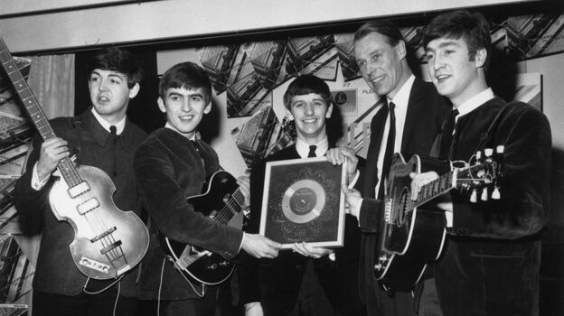 The Beatles, left to right: Paul McCartney, George Harrison, Ringo Starr, producer George Martin, John Lennon.