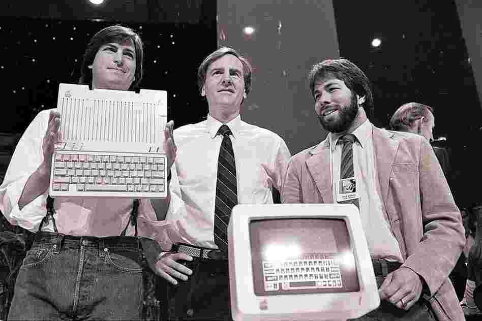 Jobs (left) with John Sculley (center) and Steve Wozniak, co-founder of Apple, unveil the new Apple IIc computer in San Francisco, 1984. 