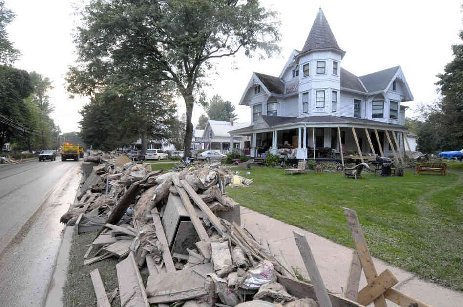 Streets in Schoharie, N.Y., are lined with storm debris and damaged furniture after Tropical Storm Irene hit in late August. Like dozens of counties across the country, Schoharie faces high costs to repair its infrastructure, putting a strain on FEMA's budget. Streets in Schoharie, N.Y., are lined with storm debris and damaged furniture after Tropical Storm Irene hit in late August. Like dozens of counties across the country, Schoharie faces high costs to repair its infrastructure, putting a strain on FEMA's budget.