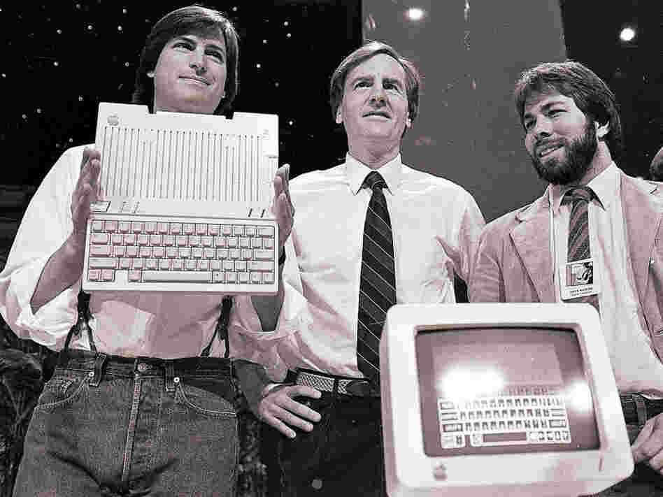 April 24, 1984, from left to right: Steve Jobs, John Sculley and Steve Wozniak unveil the new Apple IIc computer in San Francisco.