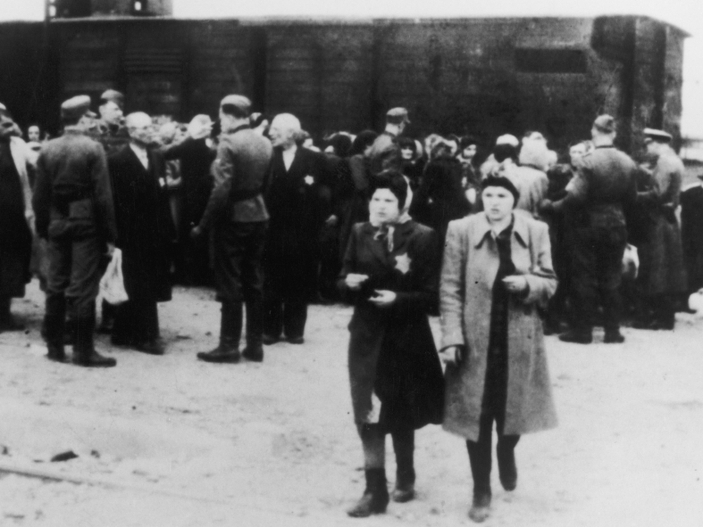  Newly arrived deportees and guards at the Nazi concentration camp at Auschwitz, Poland, circa 1943.
