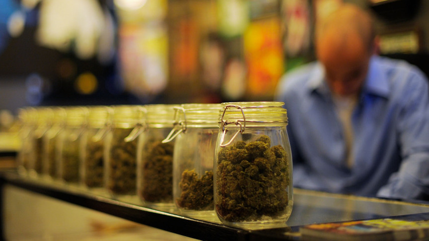 Jars full of medical marijuana are seen at a medical marijuana dispensary in Los Angeles. U.S. attorneys sent letters telling more than a dozen of the shops to shut down.