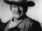 American actor John Wayne stands by the street sign honoring his name in Prescott, Ariz. The film star "was one of the defining Americans of the 20th century," says critic John Powers. American actor John Wayne stands by the street sign honoring his name in Prescott, Ariz. The film star "was one of the defining Americans of the 20th century," says critic John Powers.