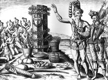 A line drawing depicts indigenous Americans making an offering of cacao beans and other foods before an altar while a conquistador looks on. Both the Mayans and Aztecs cultivated cacao. A line drawing depicts indigenous Americans making an offering of cacao beans and other foods before an altar while a conquistador looks on. Both the Mayans and Aztecs cultivated cacao.