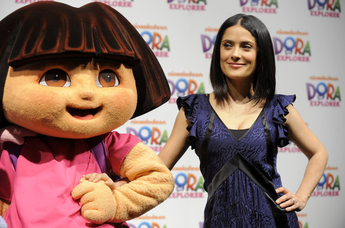 Movie star Salma Hayek poses with "Dora the Explorer" during a 10th anniversary event last year. Dora, voiced by Caitlin Sanchez, is only one of the most recent Latino stars in a long history of Latinos on television. 