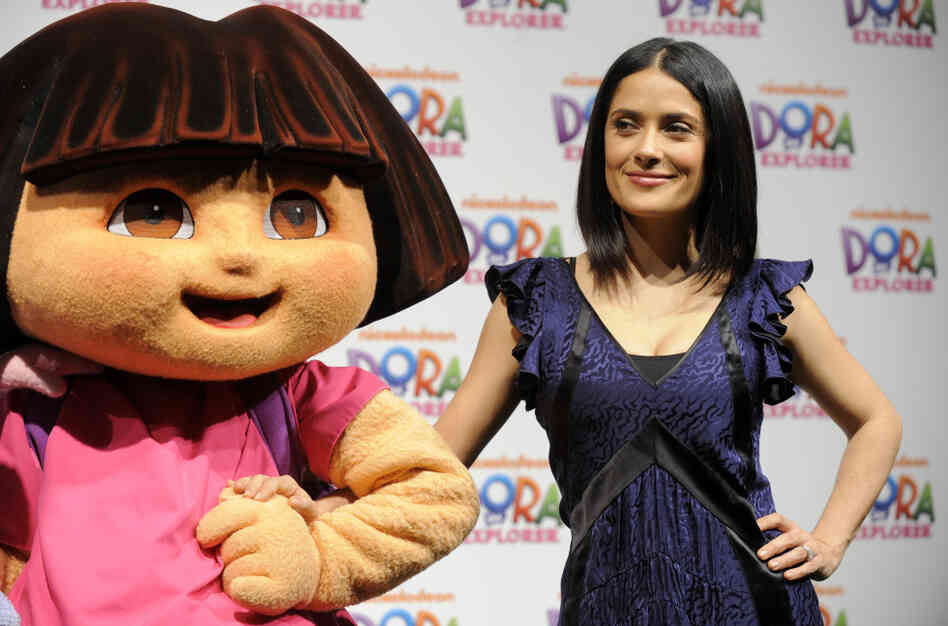 Movie star Salma Hayek poses with "Dora the Explorer" during a 10th anniversary event last year. Dora, voiced by Caitlin Sanchez, is only one of the most recent Latino stars in a long history of Latinos on television. 