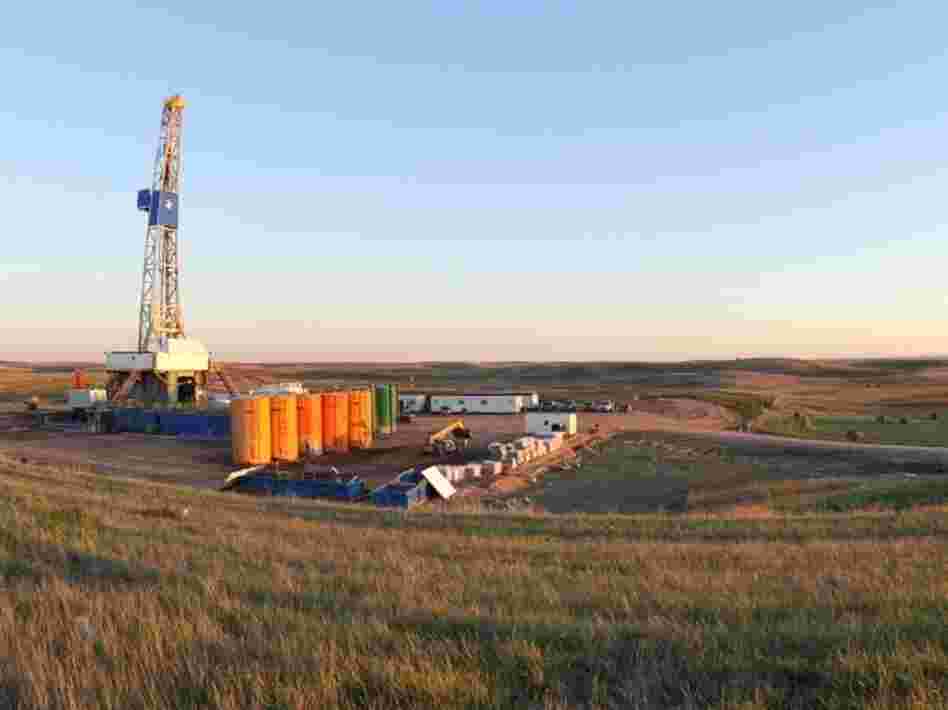 An oil drilling rig near Stanley, North Dakota. The well is being drilled into the Bakken Formation, one of the largest contiguous deposits of oil and natural gas in the United States. 