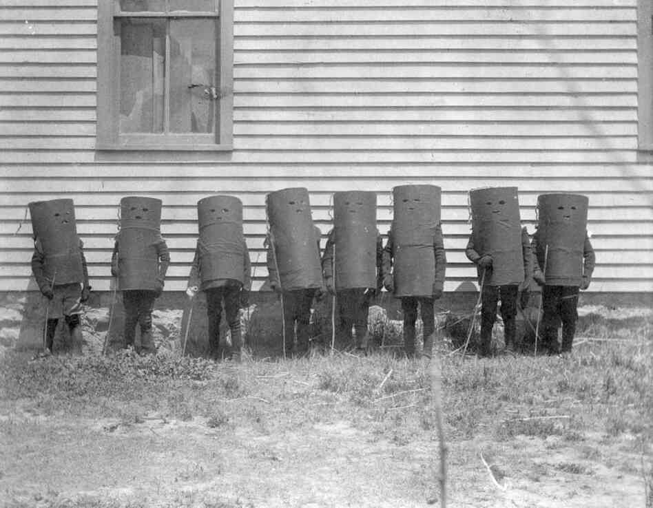 A group of children in cylinder costumes? Possibly for Halloween or a play in Oakley, Kans., 1907 A group of children in cylinder costumes? Possibly for Halloween or a play in Oakley, Kans., 1907