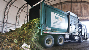 A truck dumps compost materials, including food waste, in Everett, Wash. The city of Seattle began requiring residents in 2009 to recycle their food scraps along with weekly yard waste.