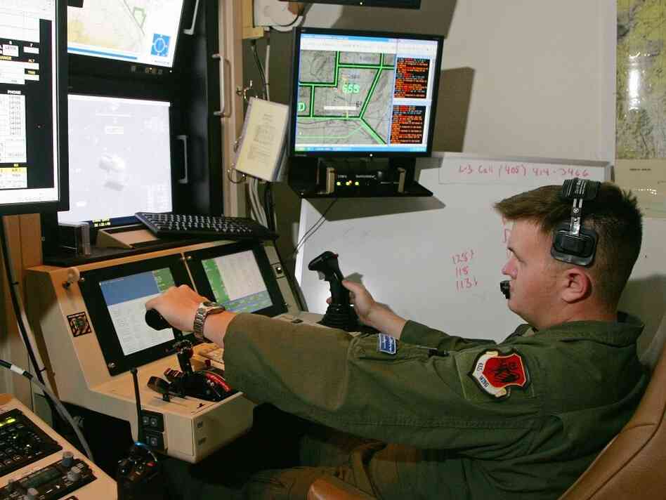 Some of the computers controlling America's fleet of drone aircraft are reportedly infected by a persistent virus. In this file photo, a senior airman remotely operates an MQ-9 Reaper during a training mission at Creech Air Force Base in Indian Springs, Nev.