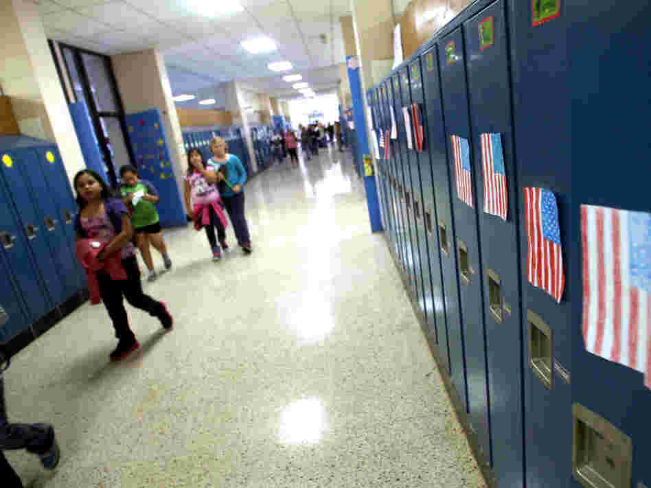 Students walk through the hallways of West Liberty Elementary School. Schools in the town were the first in the state to offer dual-language programs. 