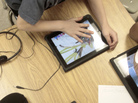 Students in a special education classroom hunch over iPads provided by the school district at Adams Elementary School in Coon Rapids, Minn. Students in a special education classroom hunch over iPads provided by the school district at Adams Elementary School in Coon Rapids, Minn.