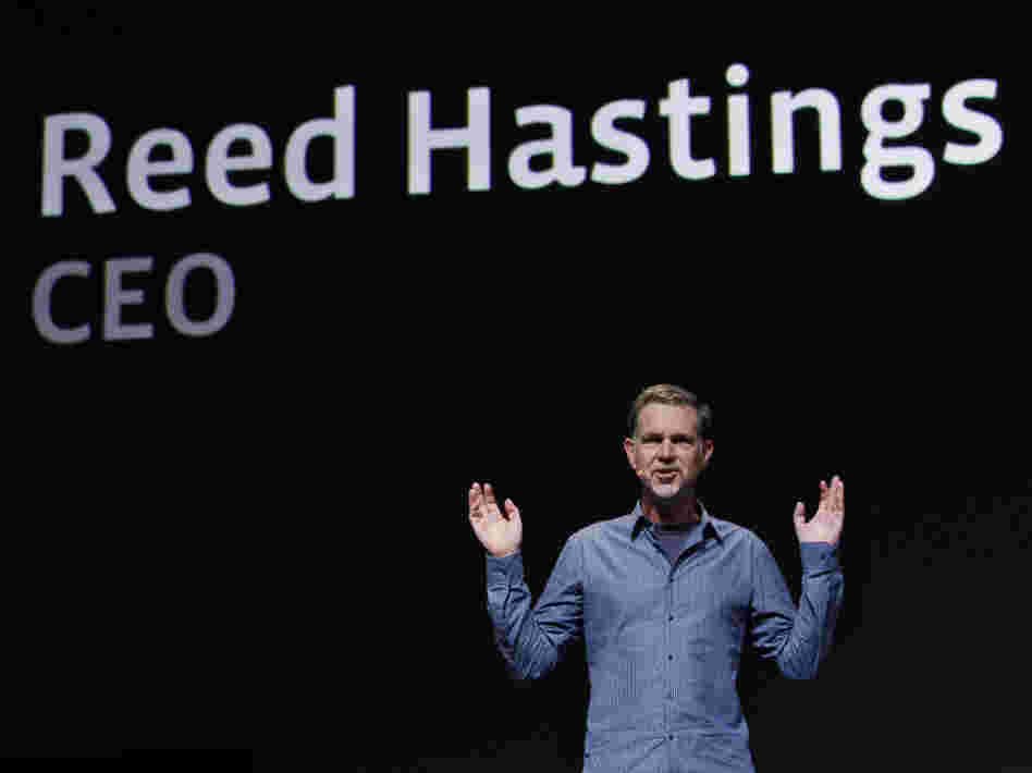 Netflix has backed off its unpopular plan to split its service into two offerings — one for streaming video, and one for sending DVDs by mail. CEO Reed Hastings is seen gesturing in this file photo.