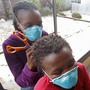 A woman, left, cuts the hair of a fellow tuberculosis patient at a clinic in the township of Khayelitsha, on the outskirts of Cape Town, South Africa, in March. A woman, left, cuts the hair of a fellow tuberculosis patient at a clinic in the township of Khayelitsha, on the outskirts of Cape Town, South Africa, in March.