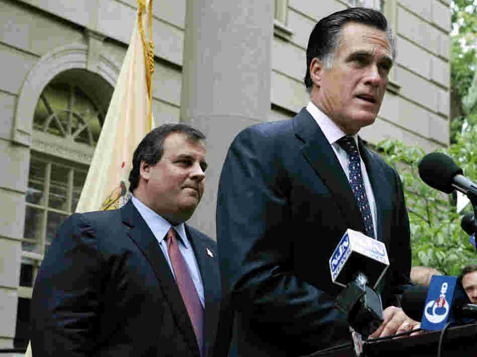 Then-New Jersey gubernatorial candidate Chris Christie listens as Mitt Romney endorses him in the GOP primary, May 28, 2009.