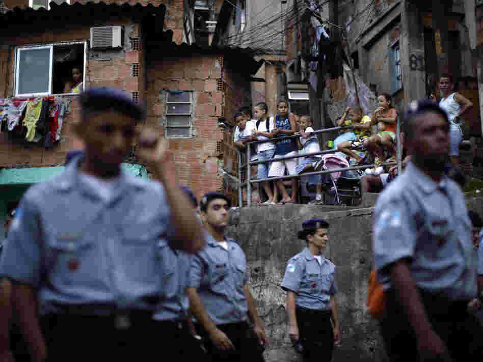 Police officers of the Peacemaker Police Unit program, UPP, patrol the Morro dos Macacos slum last year. The city has stepped up efforts at community policing in order to rid the favelas of drug traffickers.