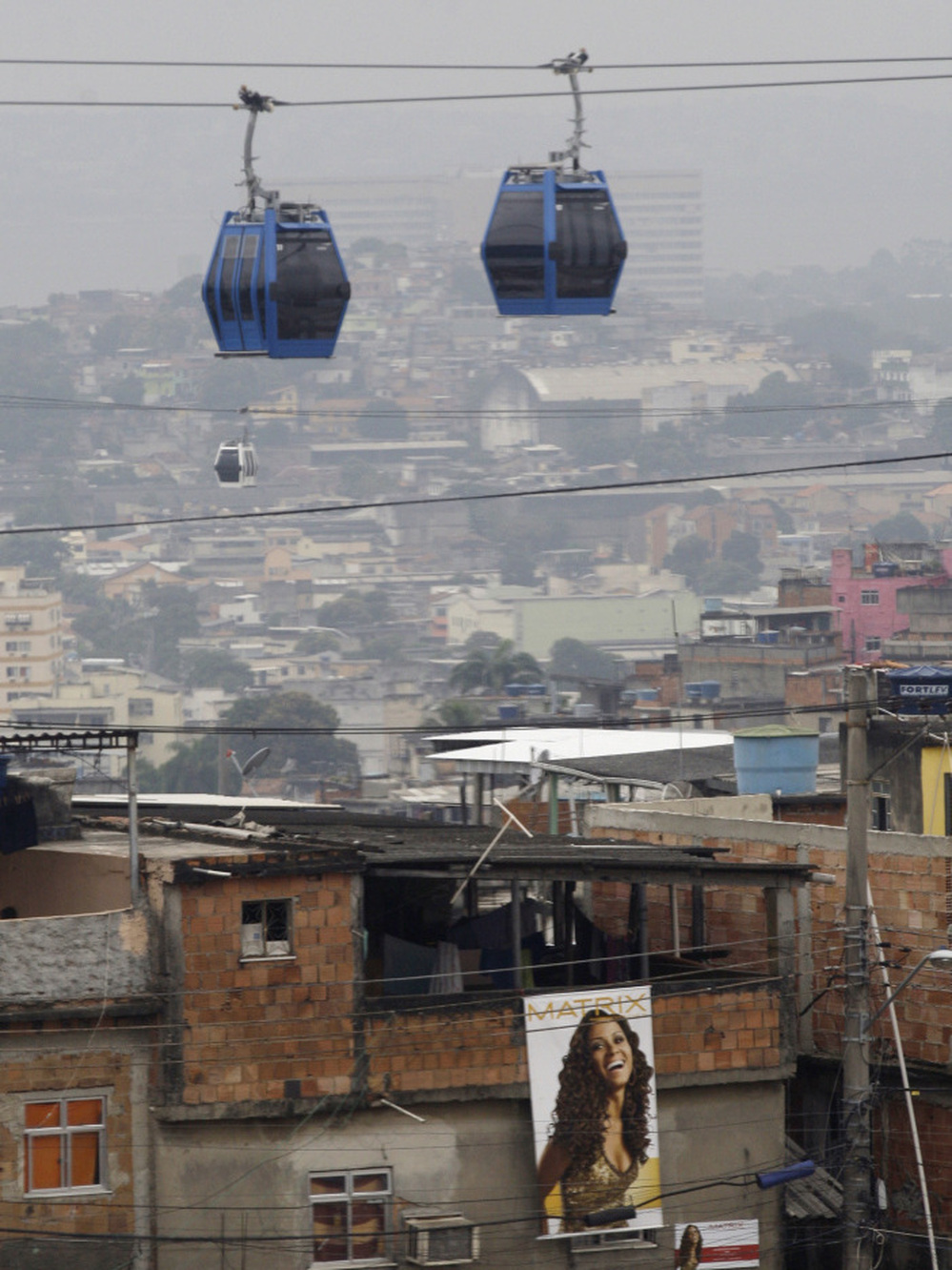 New services and infrastructure for Rio de Janeiro's favelas include cable cars, such as this one in the Complexo de Alemao slum. 