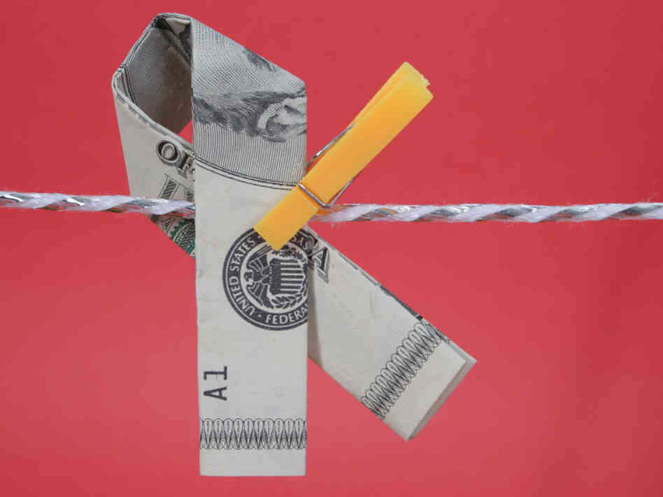 A memorial ribbon fashioned from U.S. currency. A memorial ribbon fashioned from U.S. currency.