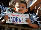 It's hard to relate America's love for the NFL to the broader national temperament — but the league now dominates all sports. Here, a young Oakland Raiders fan watches his team on a recent Sunday. It's hard to relate America's love for the NFL to the broader national temperament — but the league now dominates all sports. Here, a young Oakland Raiders fan watches his team on a recent Sunday.