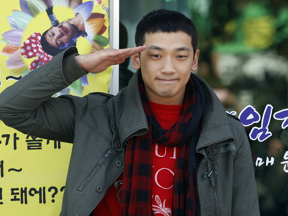 South Korean pop singer Rain gave a military salute to his fans today before entering the army.