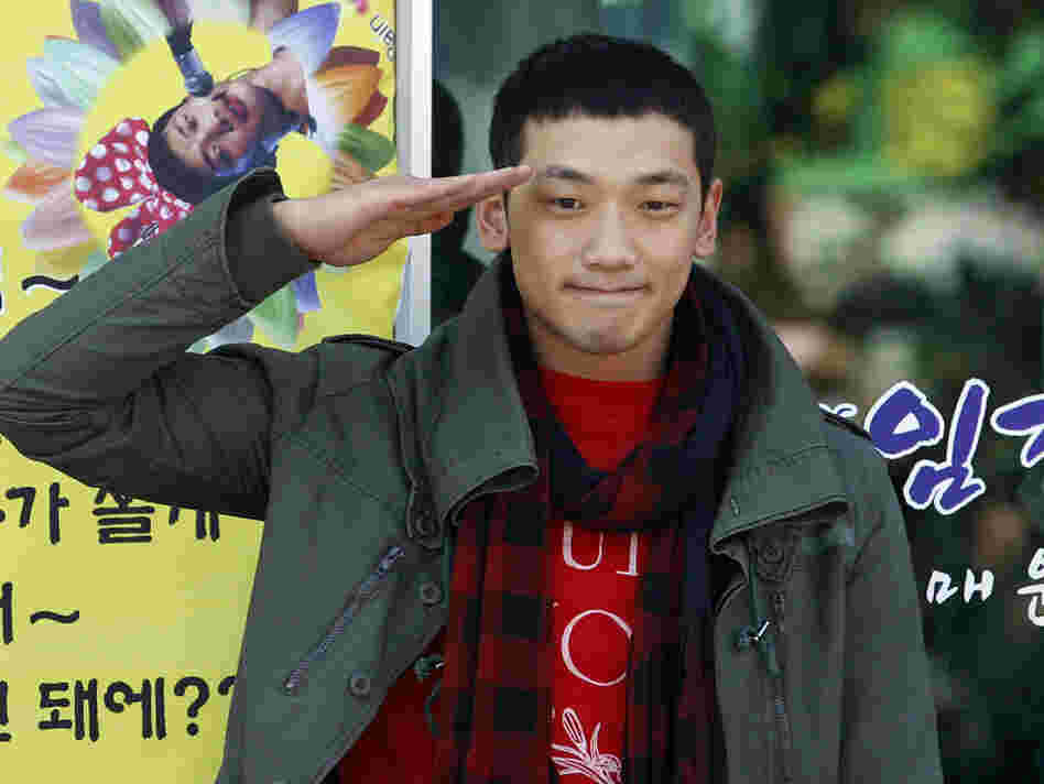 South Korean pop singer Rain gave a military salute to his fans today before entering the army.