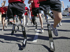 Military members who lost their limbs overseas participate in a run in California. Military members who lost their limbs overseas participate in a run in California.