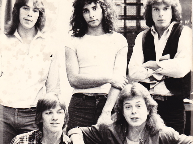 With shaggy hair and skinny jeans, Jon Huntsman (upper right) strikes a pose with his band, Wizard. 