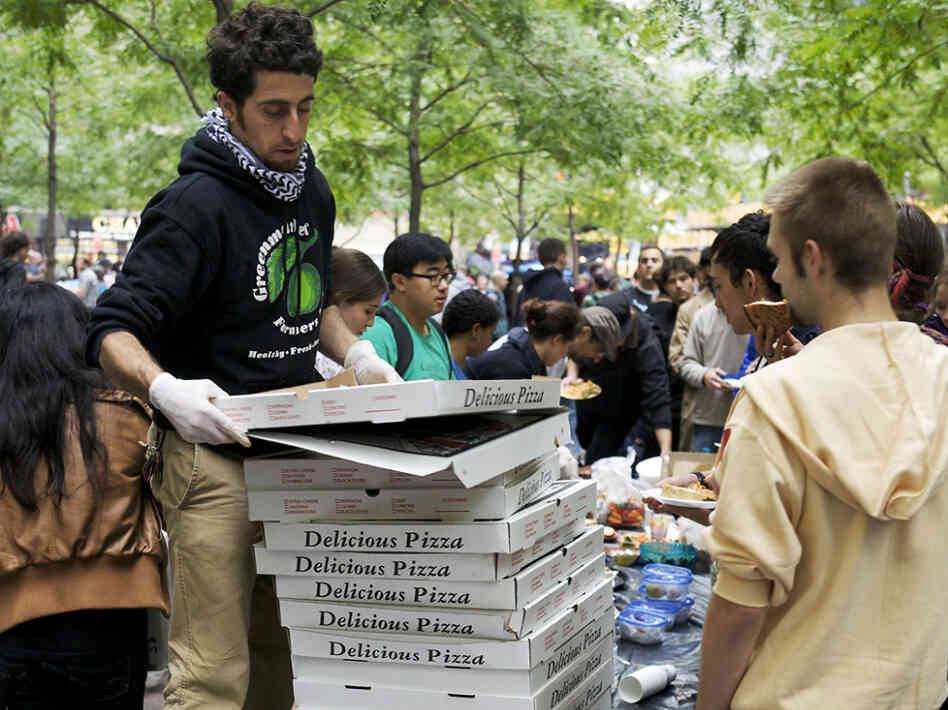 Donated pizzas are handed out in Zuccotti Park for the Occupy Wall Street protesters.