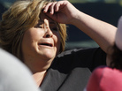 An onlooker reacts near the site where six people were killed and three were wounded in a shooting at a hair salon in Seal Beach, Calif. An onlooker reacts near the site where six people were killed and three were wounded in a shooting at a hair salon in Seal Beach, Calif.