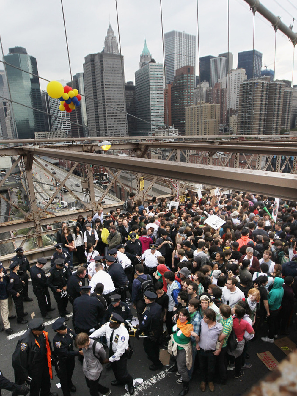 Police arrest two Occupy Wall Street demonstrators after they tried to cross the Brooklyn Bridge on Oct. 1. Media coverage spiked after the incident.