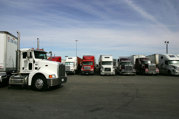 A truck stop near Hesperia, Calif. To address a shortage of truck drivers resulting from a mismatch of skills in the labor market, some trucking companies have started free driving schools with the promise of a job upon completion.