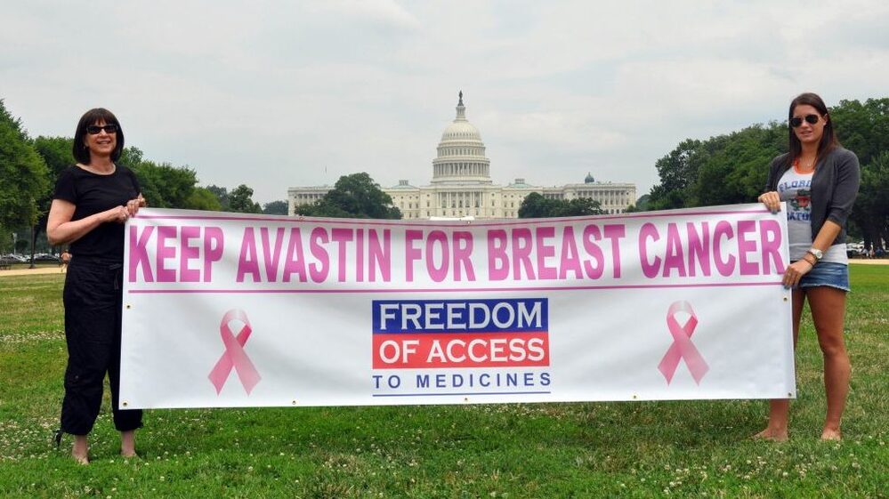 Arlene Kalley and her daughter Leila, who support the use of Avastin for breast cancer, hold a banner outside the National Mall in Washington in June.