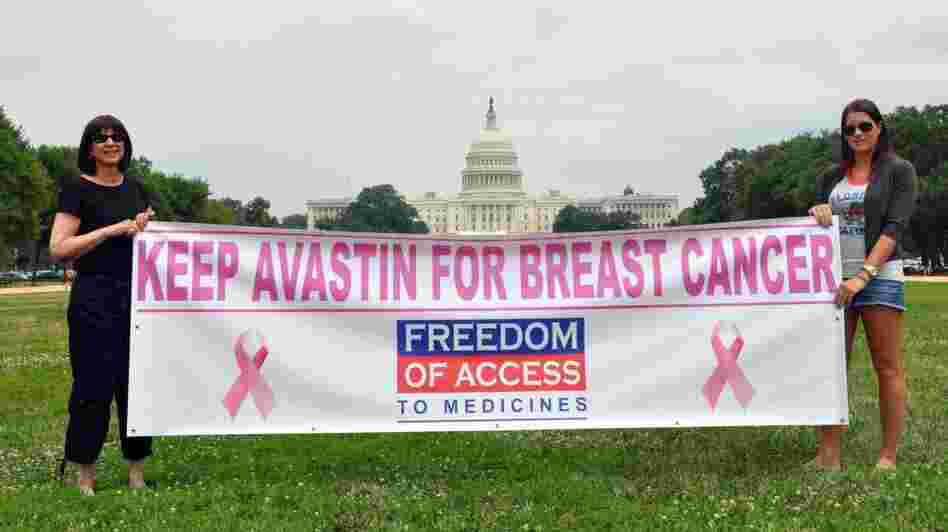 Arlene Kalley and her daughter Leila, who support the use of Avastin for breast cancer, hold a banner outside the National Mall in Washington in June.